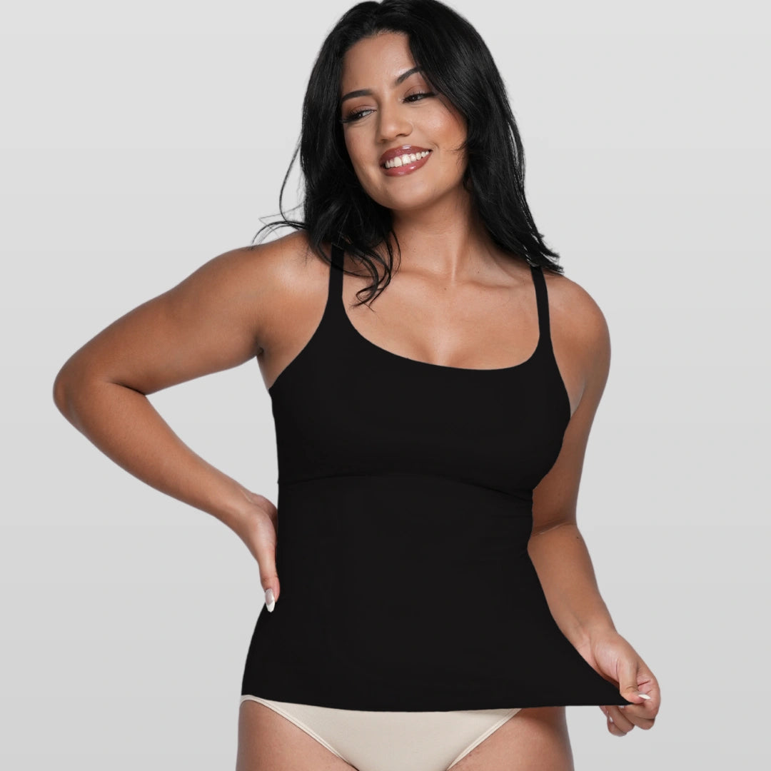 A woman wearing a black Luxmery sculpting scoop neck cami, which is a piece of shapewear.